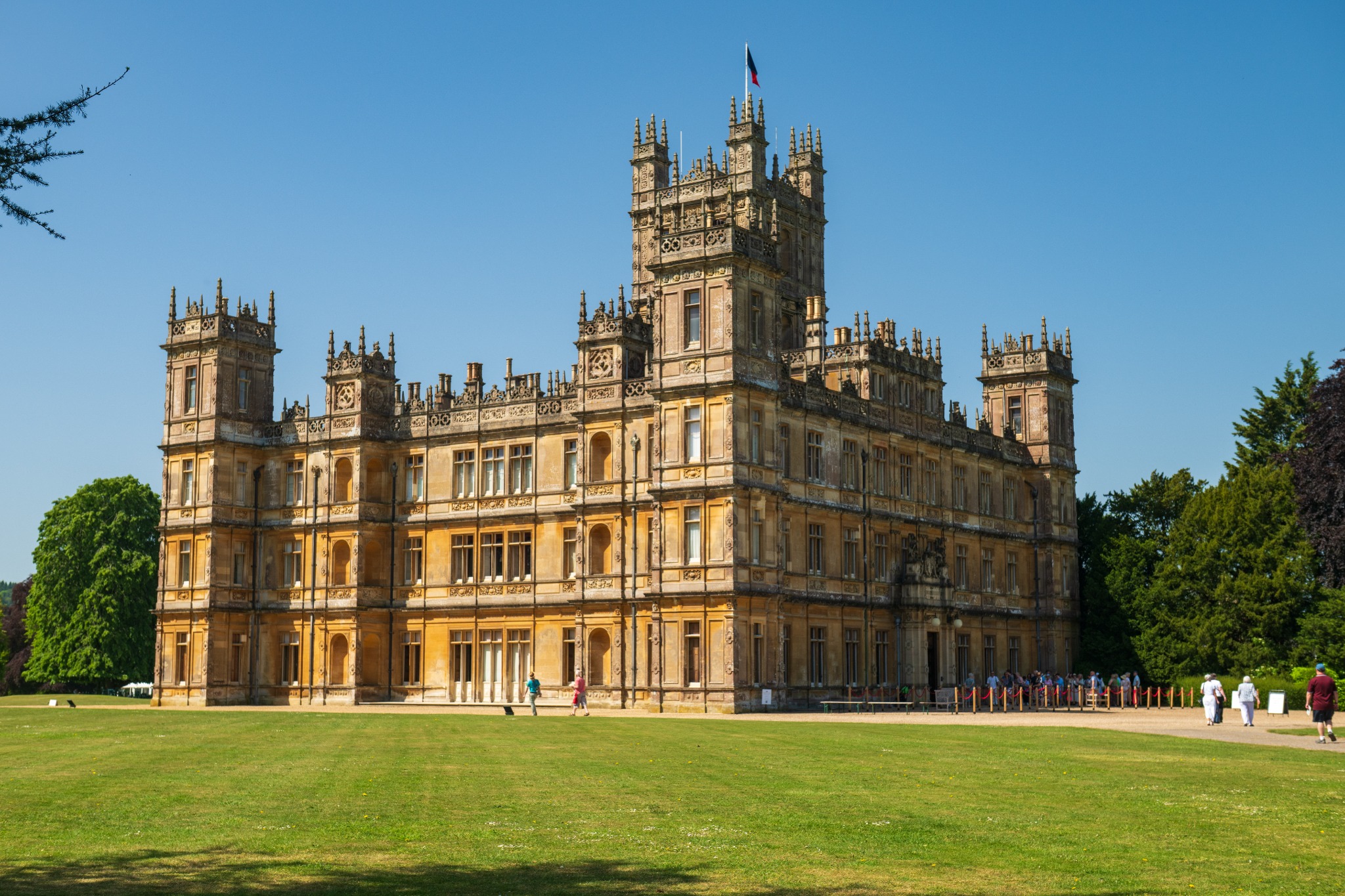 Highclere Castle framed by its sweeping green parkland