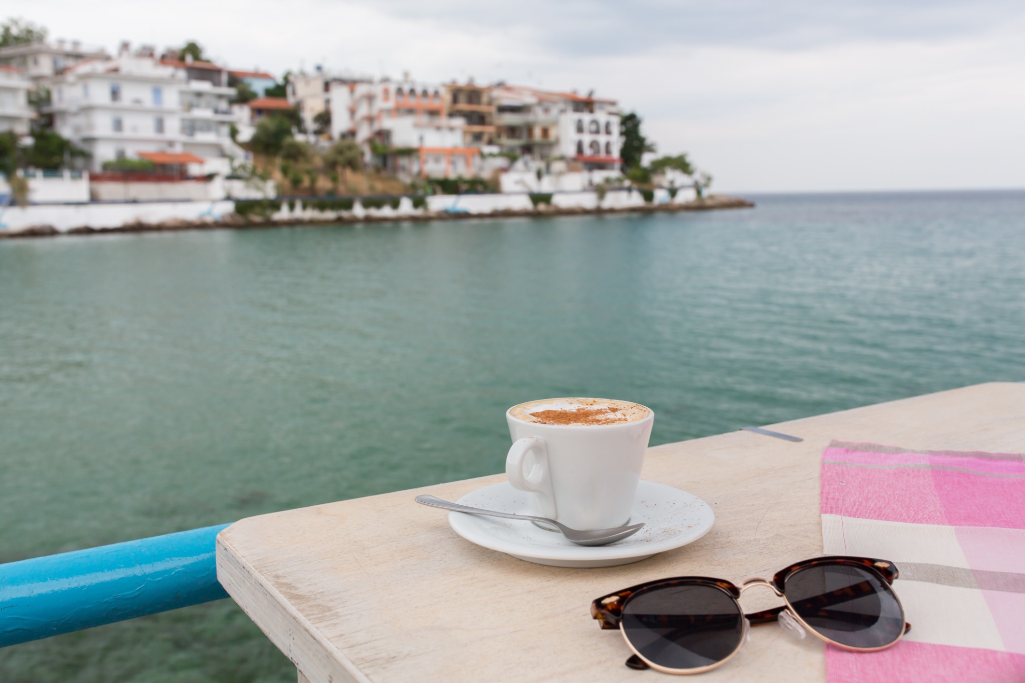 A cappuccino enjoyed beside a peaceful coastal view